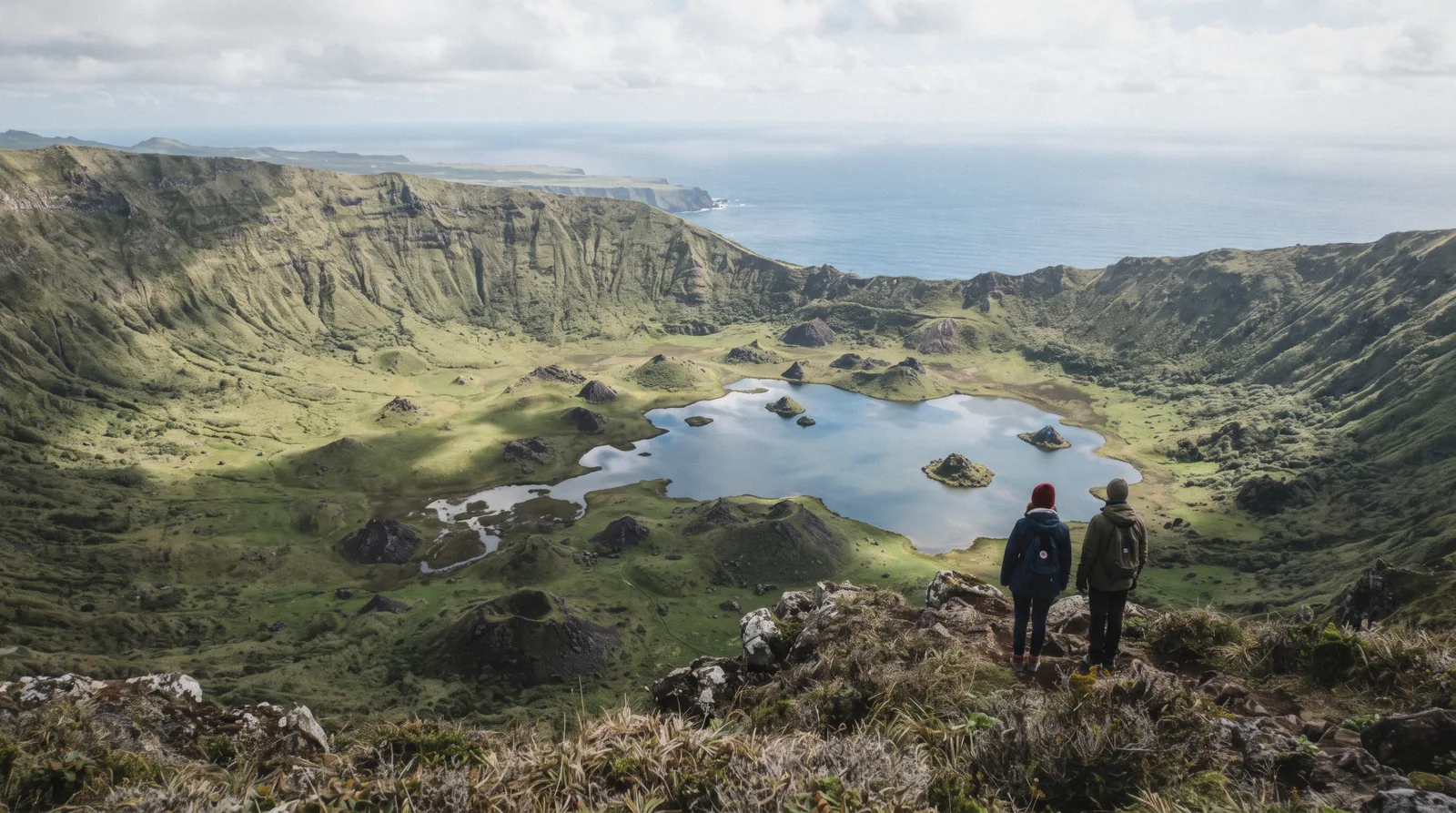 The Caldeirão crater lake on Corvo island with its small volcanic cones, seen from the crater rim