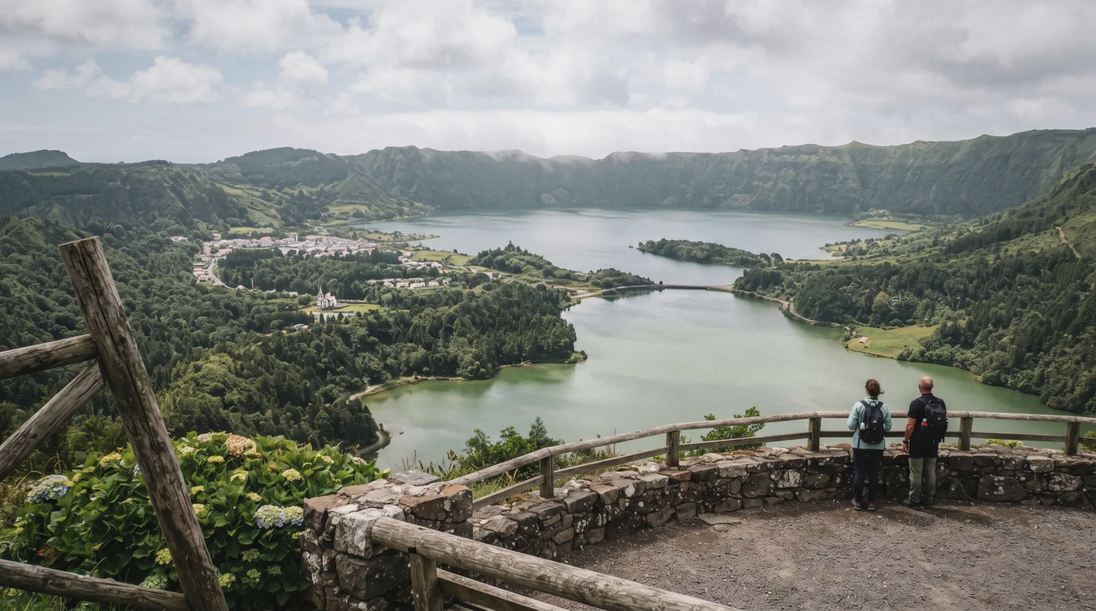 The blue and green lakes of Sete Cidades inside their crater, seen from the Vista do Rei viewpoint