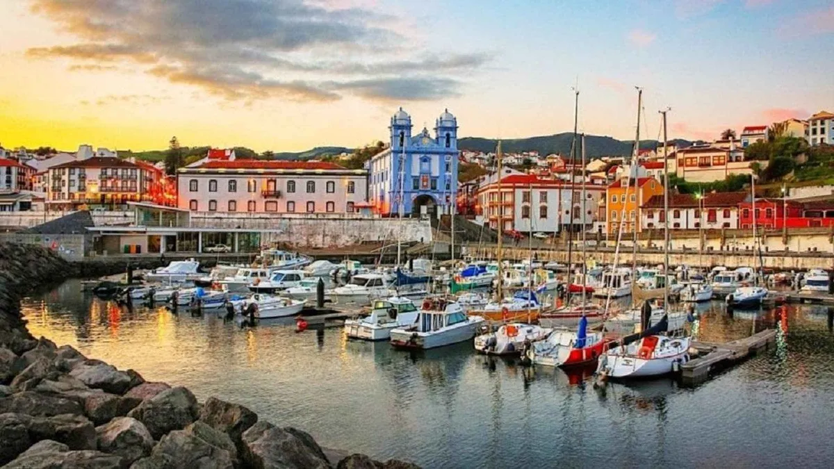The marina and blue-and-white Se Cathedral of Angra do Heroismo at sunset on Terceira