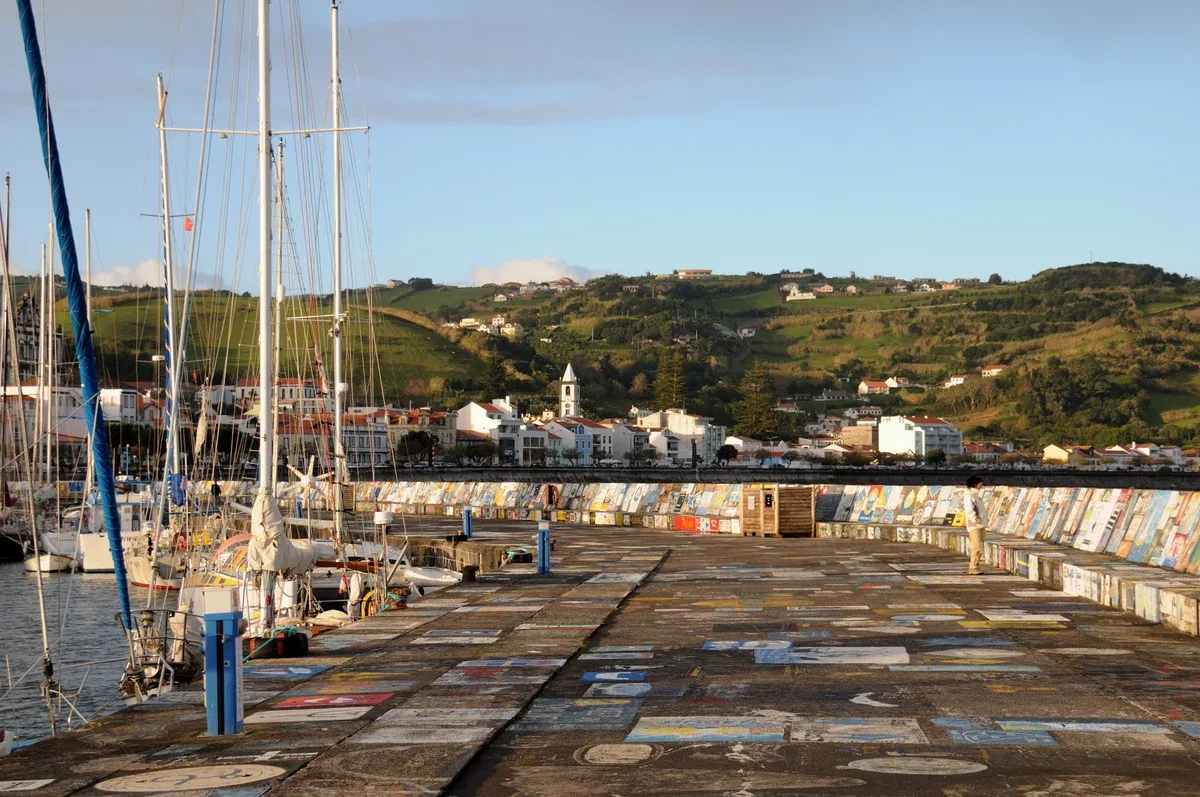 Moored sailing boats and sailors paintings at Horta Marina on Faial