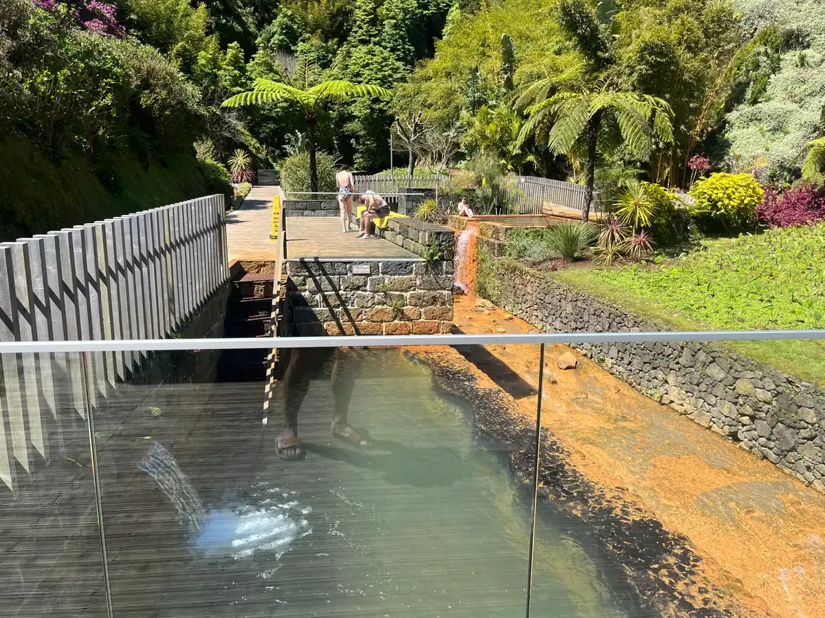 The iron-rich water channel and deck at Poca da Dona Beija, Furnas