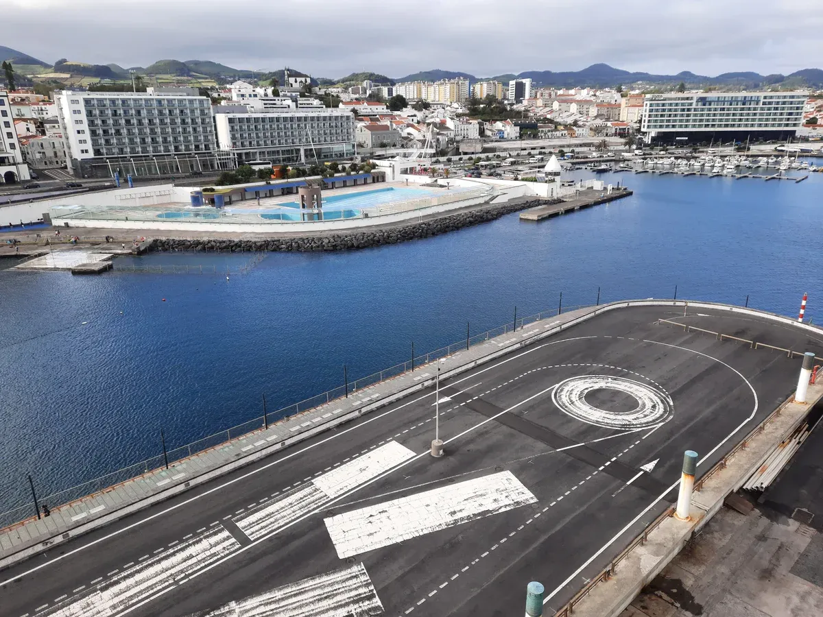The port and marina of Ponta Delgada seen from the cruise terminal, with the town's waterfront and hotels behind